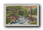 Click to enlarge (unmarked) stream with rocks next to road