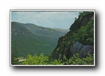 Click to enlarge The Cliffs of Chimney Rock Mountain see from the head of Hickory Nut Falls.