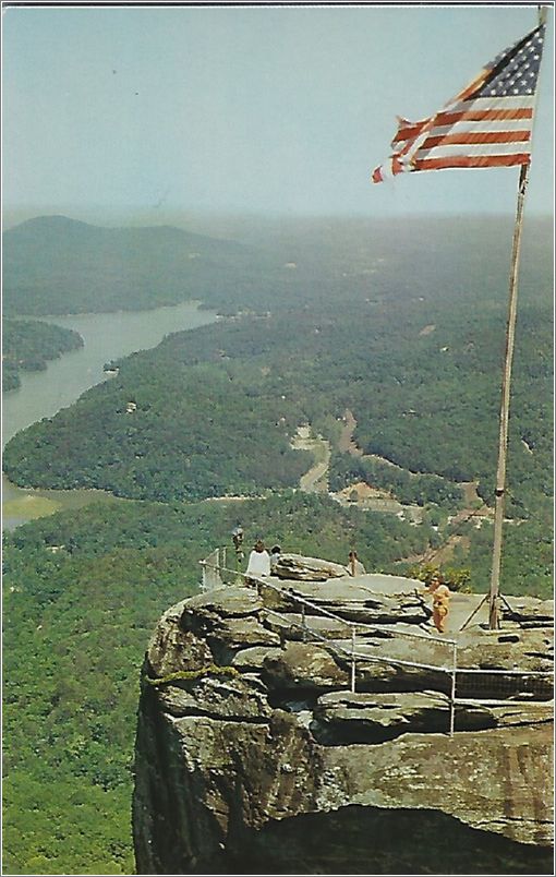 Looking over the top of Chimney Rock, showing Lake Lure in the distance, as seen from the Opera Box at Chimney Rock park, Chimney Rock, North Carolina x19-ckcl024a01-f